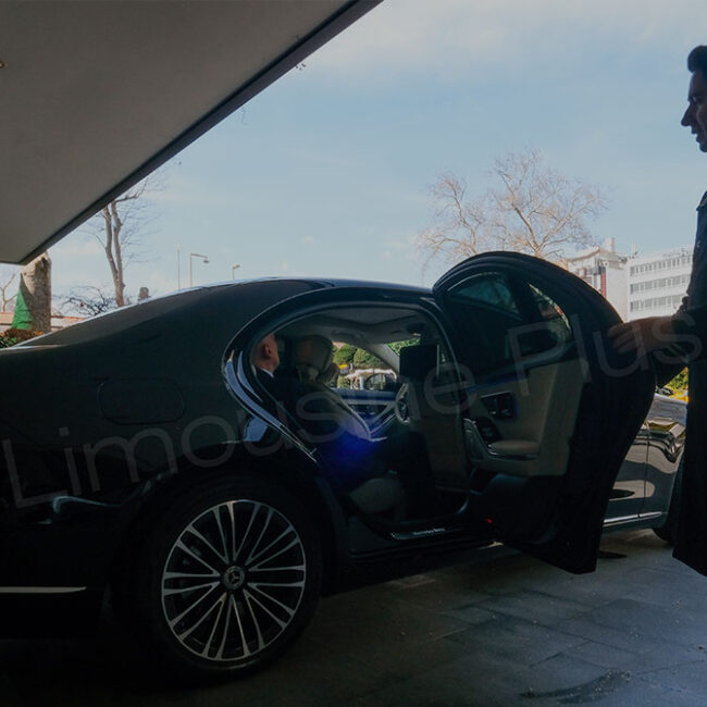 Chauffeur Opening Luxury Car Door