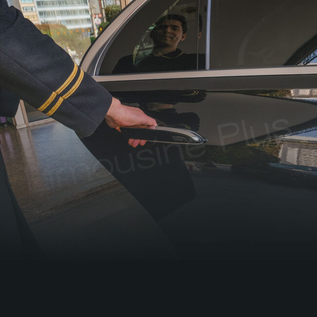 Professional Chauffeur Opening Luxury Car Door