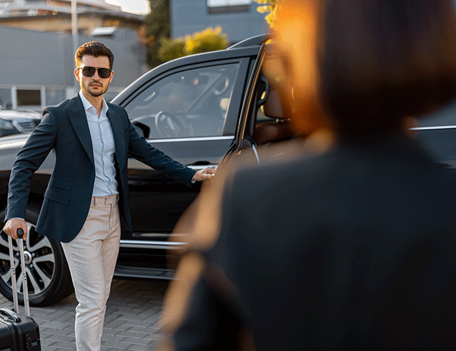 A stylish male passenger arriving at his destination, getting out of a luxury Limousine Plus van after a comfortable transfer in Istanbul.