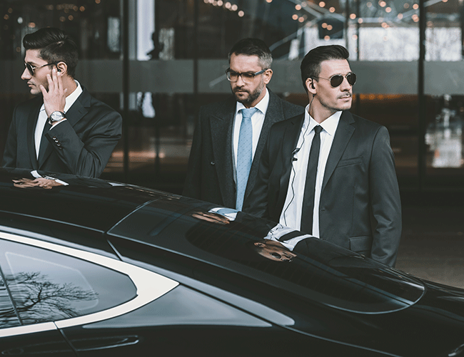 A client with his close protection team standing by a secure vehicle, demonstrating Limousine Plus's executive protection and transport service in Istanbul.